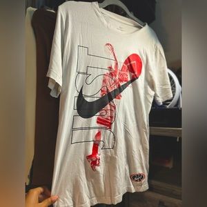 Nike- oversize tee graphic tee with red, black white coloring all around